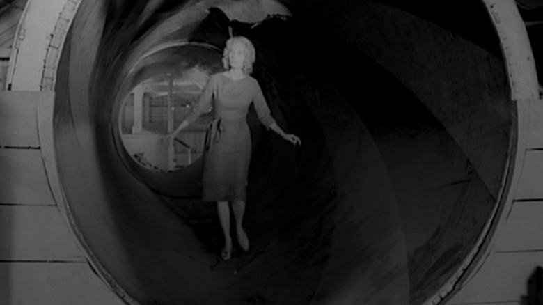 Mary Henry walks through tunnel