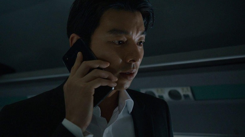 Seok-woo on cellphone