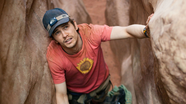 James Franco climbs in 127 Hours