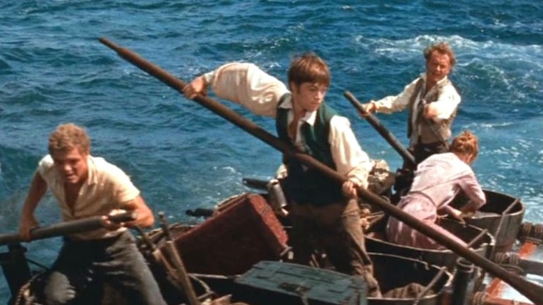 The cast of Swiss Family Robinson on a rowboat 