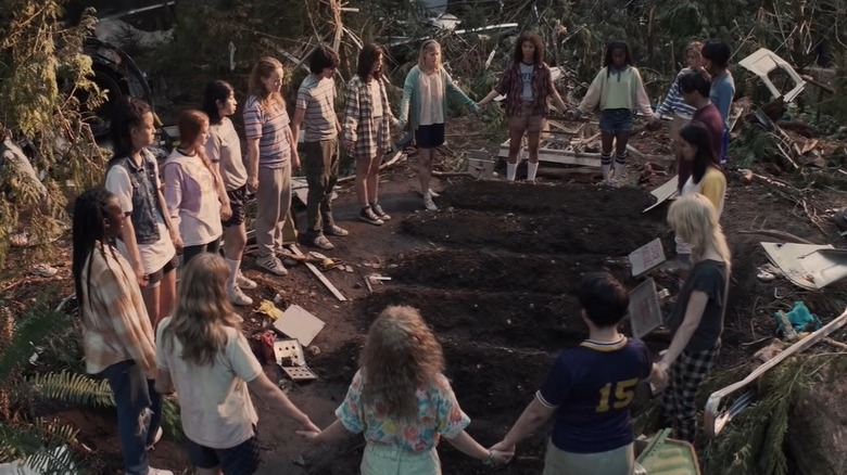 Yellowjackets cast standing around graves