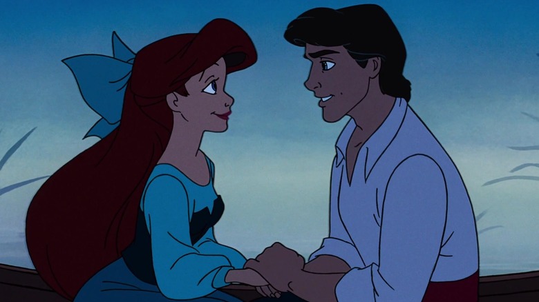 Ariel and Eric holding hands