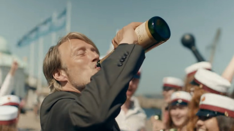 Mads Mikkelsen drinking 