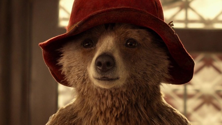 Paddington wearing a red hat