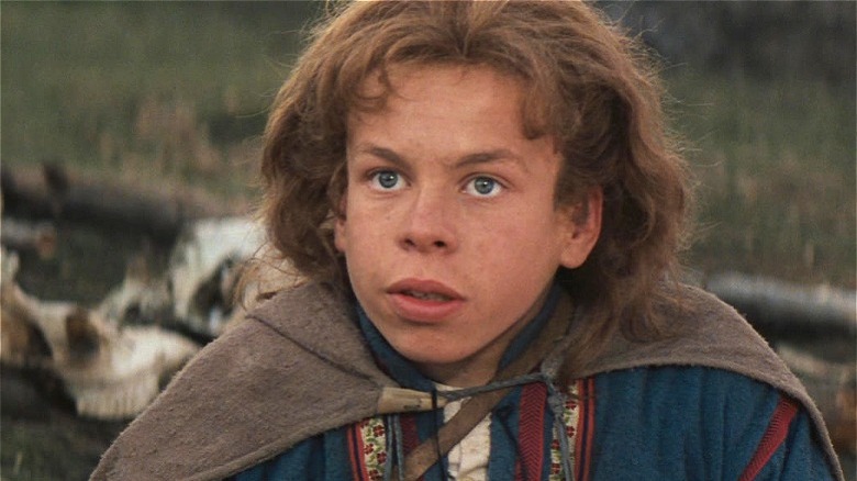 Warwick Davis wearing a cape