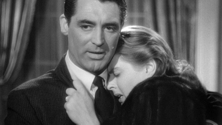 Cary Grant holding Ingrid Bergman 