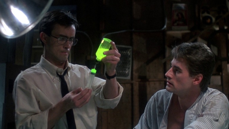 Herbert West with syringe of green liquid