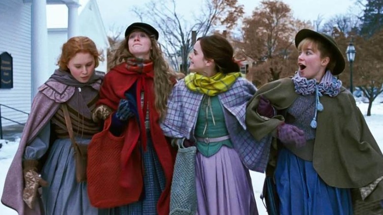 The cast of Little Women walking arm in arm