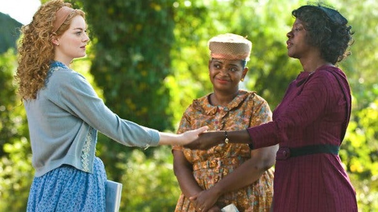 Emma Stone, Octavia Spencer, and Viola Davis shaking hands