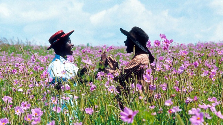 two women in a field of purple flowers