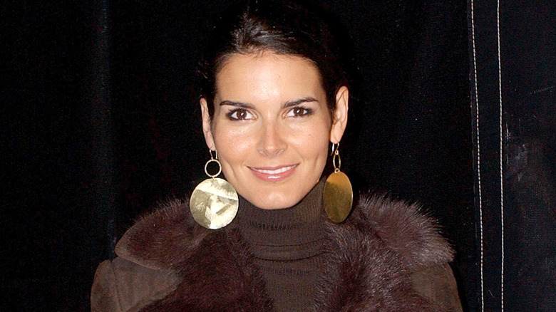 Angie Harmon wearing gold earrings