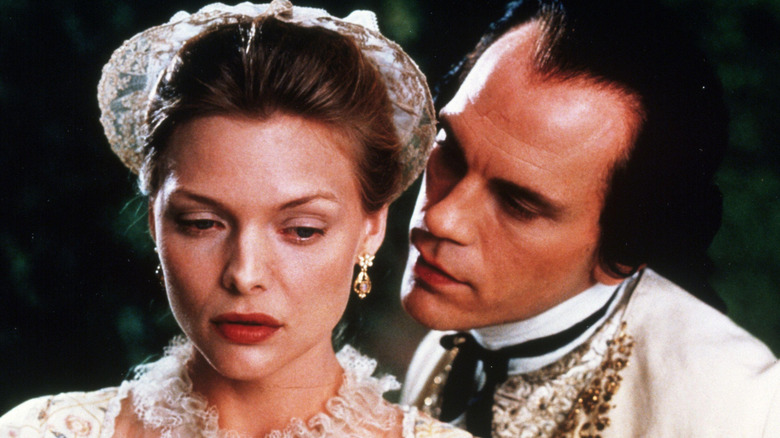 Vicomte de Valmont whispering in Madame de Tourvel's ear (1988)