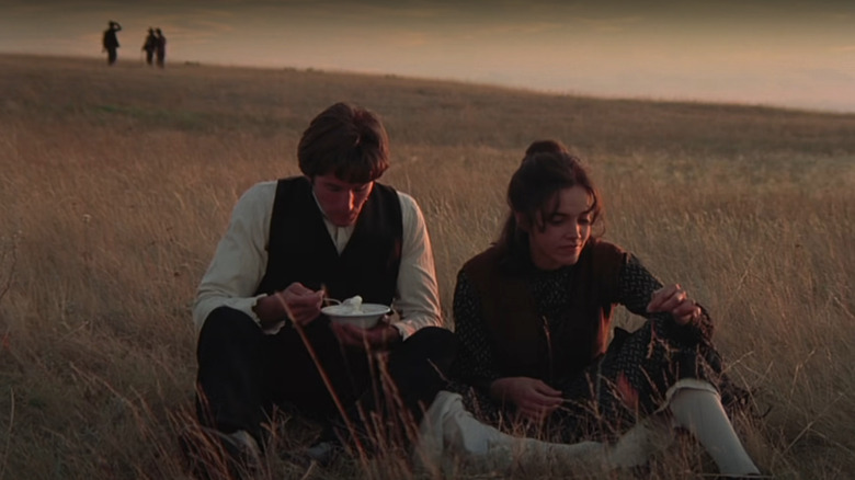 Bill and Abby sitting in field