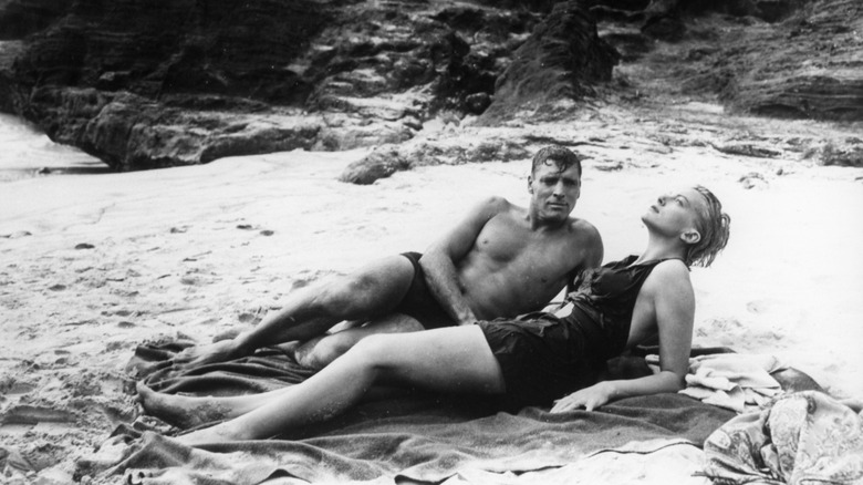 Karen and Milton laying on beach