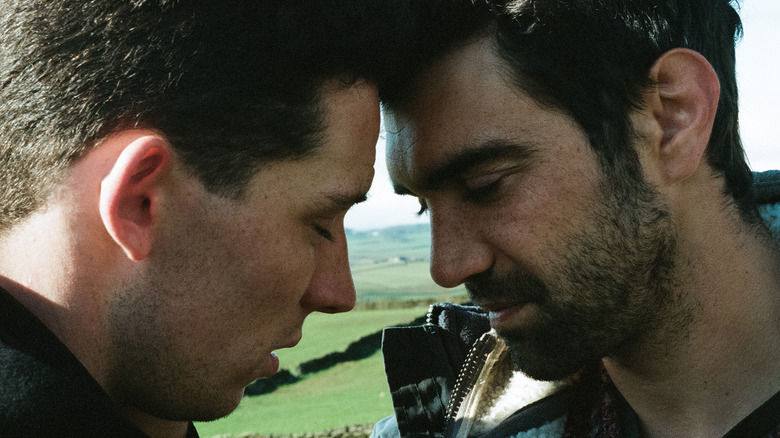 Johnny and Gheorghe touching foreheads with eyes closed