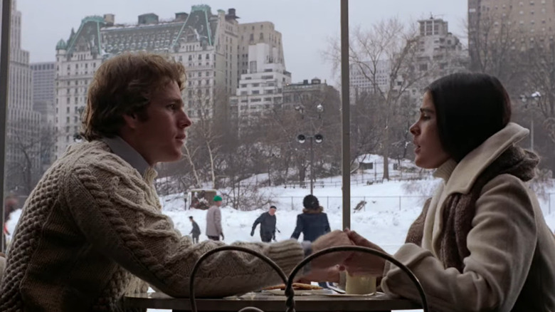 Oliver and Jennifer  sitting in cafe while it snows