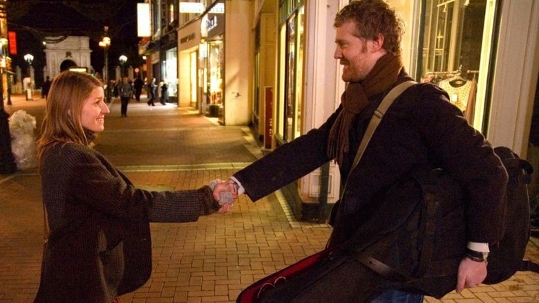 Guy and Girl shaking hands in Once