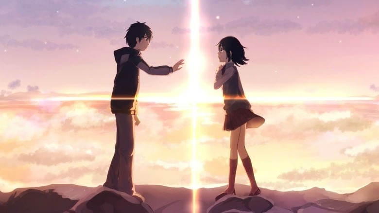 Taki and Mitsuha approach each other with ray of light between