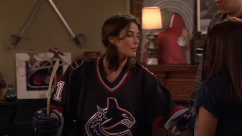 Robin wearing hockey jersey