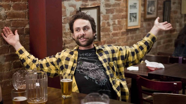 Charlie Kelly raises his arms