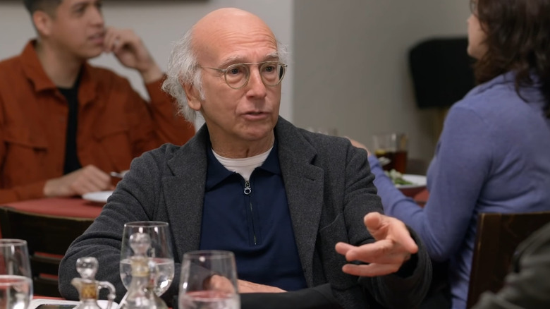 Larry David talking in restaurant