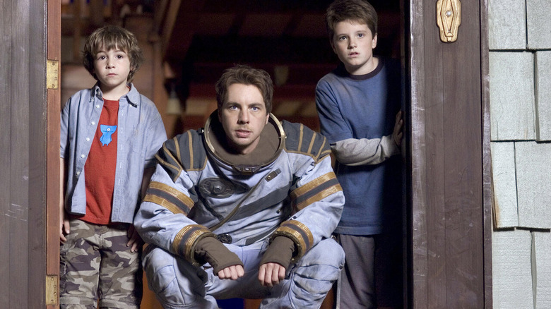 characters stood by doorway in Zathura