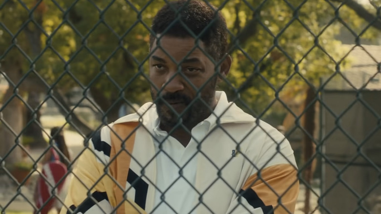 Richard Williams watches through fence