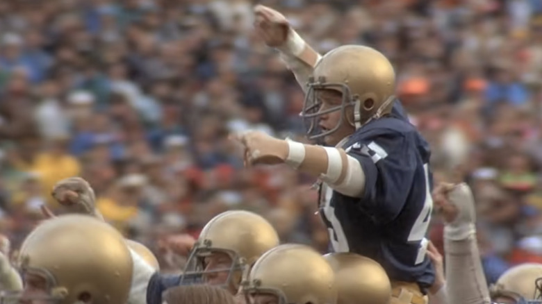 Rudy Ruettiger carried on team's shoulders