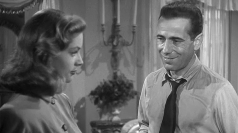 Humphrey Bogart and Lauren Bacall flirting