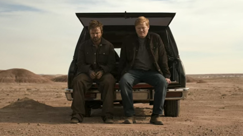 Jesse Pinkman and Todd Alquist sit on back of car