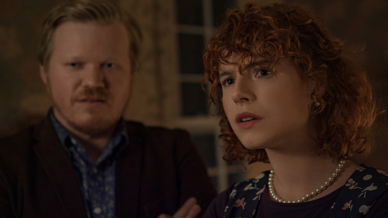 Jesse Plemons and Jessie Buckley peering skeptically