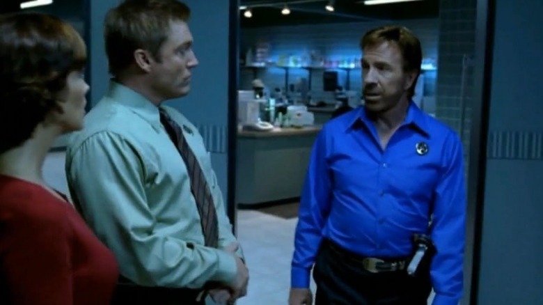 Chuck Norris talking wearing badge