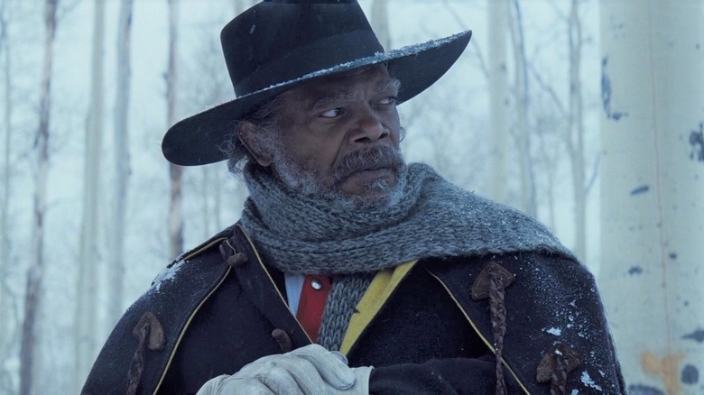 Major Marquis Warren stands in snow