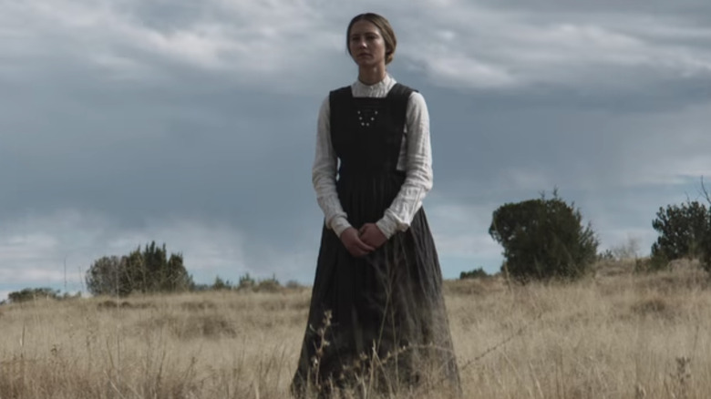 Lizzy Macklin stands on prairie