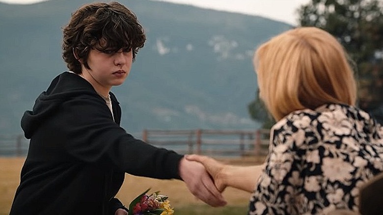 Carter shaking hands with Beth Dutton