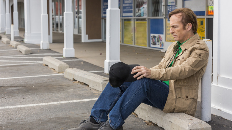 Jimmy sitting on curb