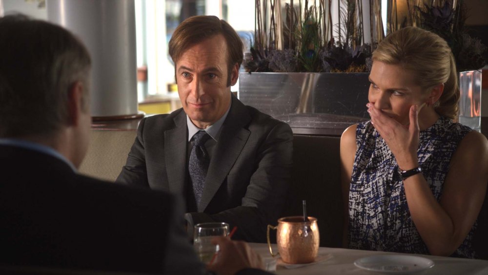 Bob Odenkirk as Jimmy and Rhea Seehorn as Kim scamming a mark on Better Call Saul