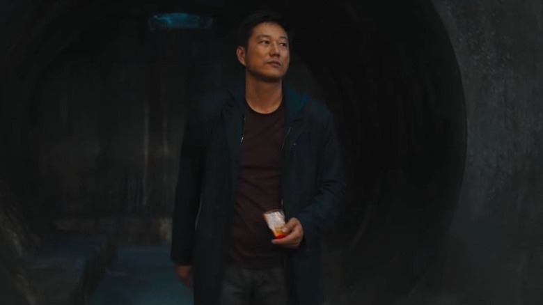 Han walks into a room holding snacks 