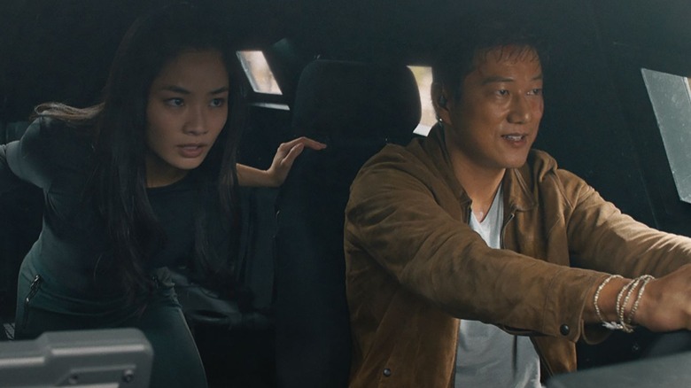 Han drives car with Elle in backseat