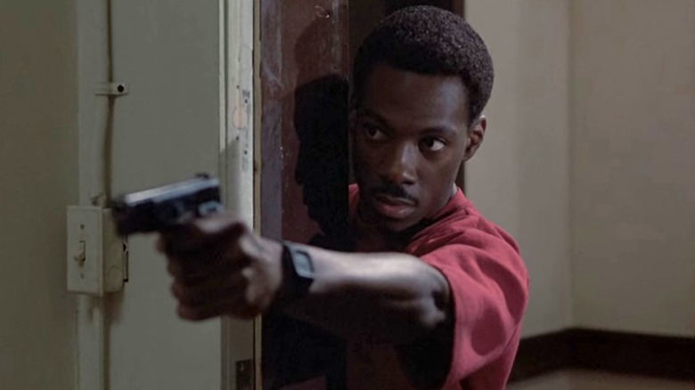 Axel Foley holds a gun