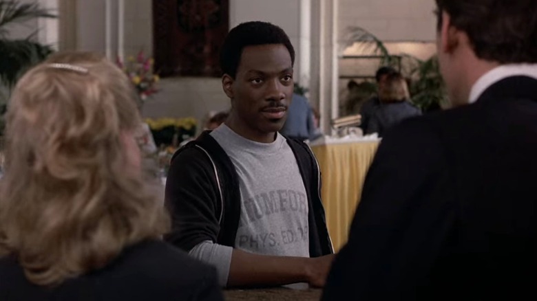 Axel Foley wears gray shirt