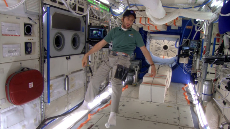 Howard floating in space station