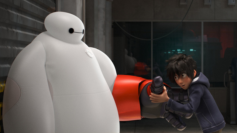 Hiro putting glove on Baymax