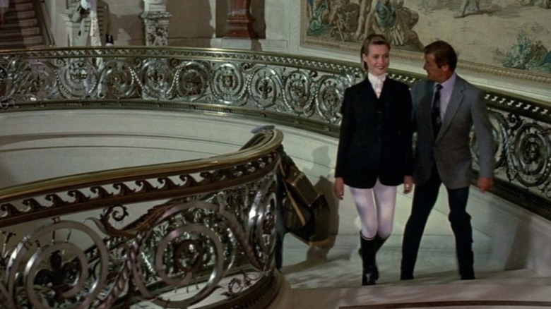 James Bond and Jenny Flex walk up stairs