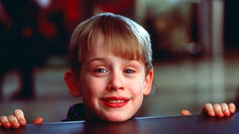 Macaulay Culkin chin on table