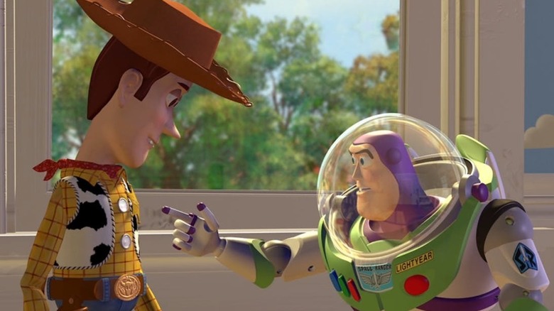 Buzz points at Woody 