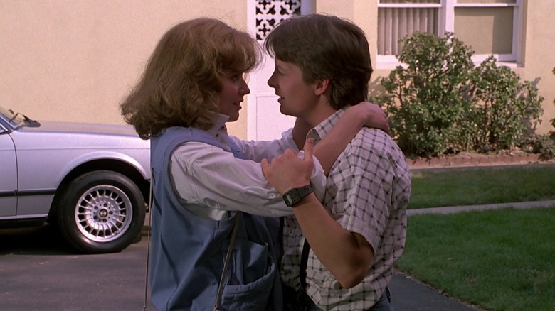 Marty McFly embracing Jennifer Parker