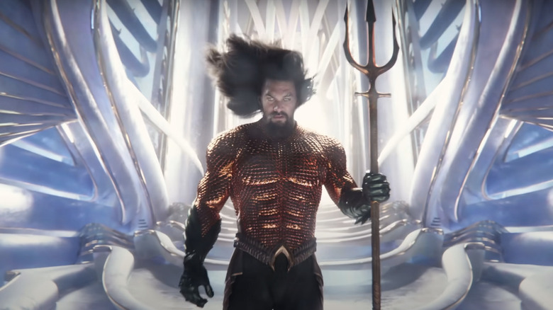 Aquaman holding trident at throne