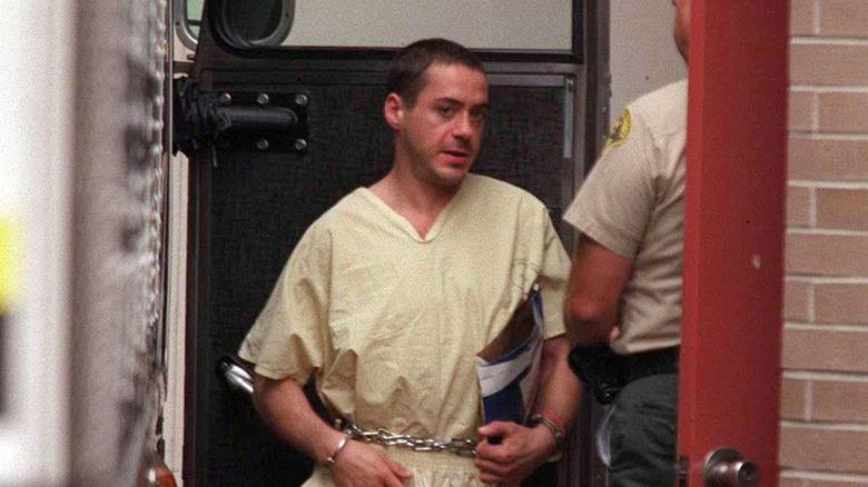 Downey in cuffs in court