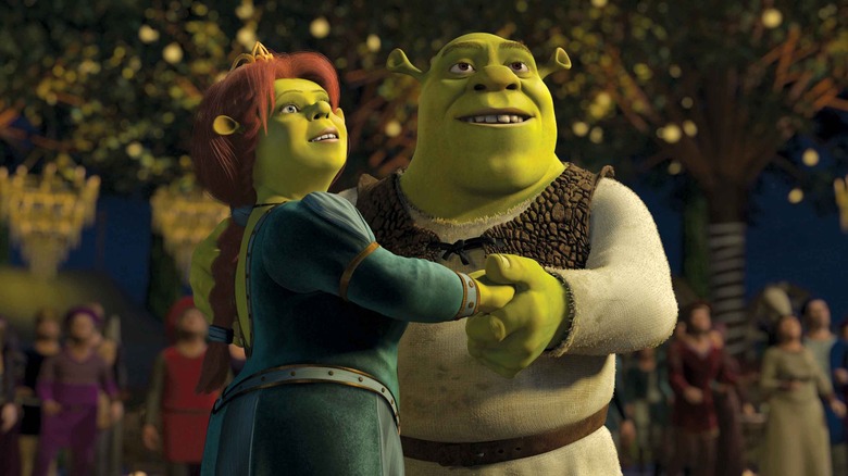 Shrek and Fiona hold hands